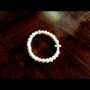 Girl’s pearl like cross bracelet